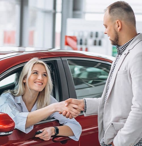 A customer collecting the keys to their electric hire car